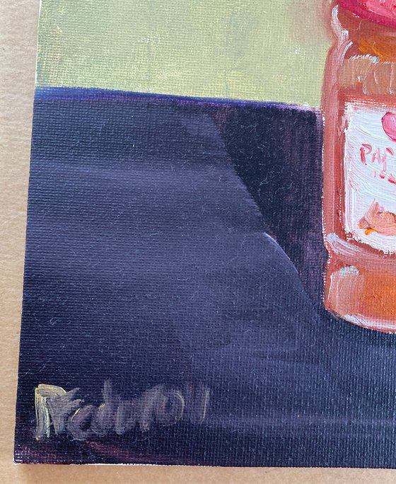 Still life with a bottle of olive oil and paprika