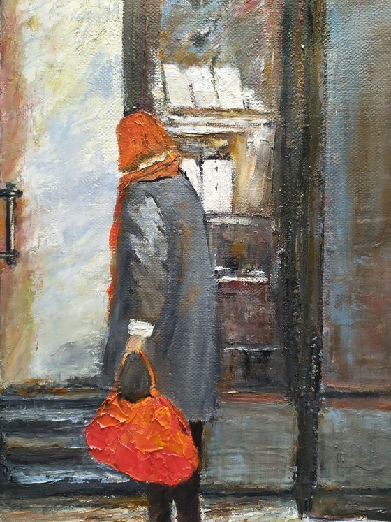 The woman with red bag