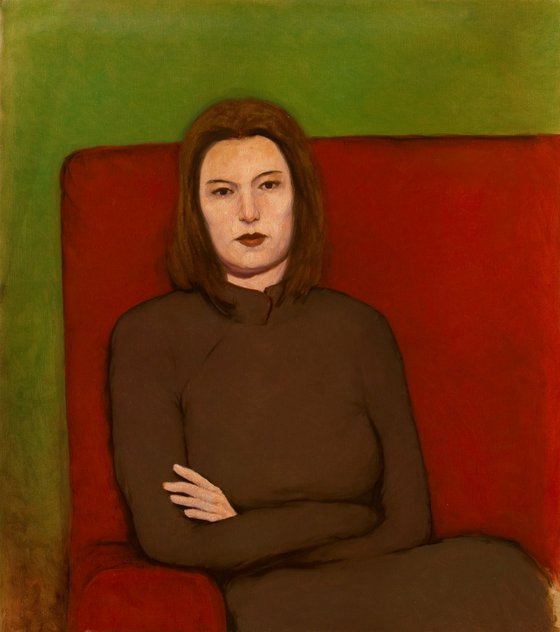 woman in grey on a red sofa