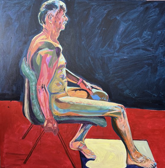 Seated Chap in dark blue room