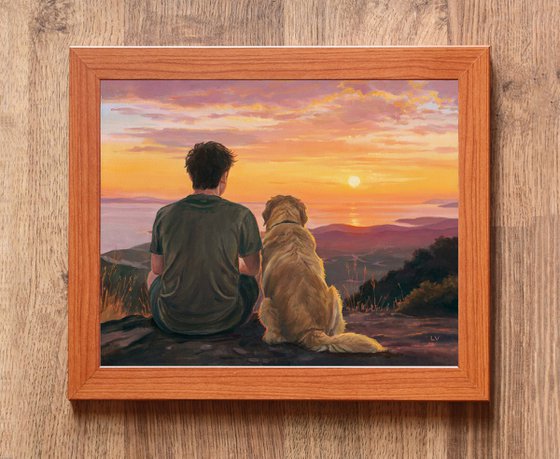 Boy sitting with a Golden Retriever dog