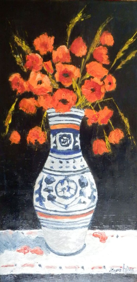 Poppy flowers in a traditional pot
