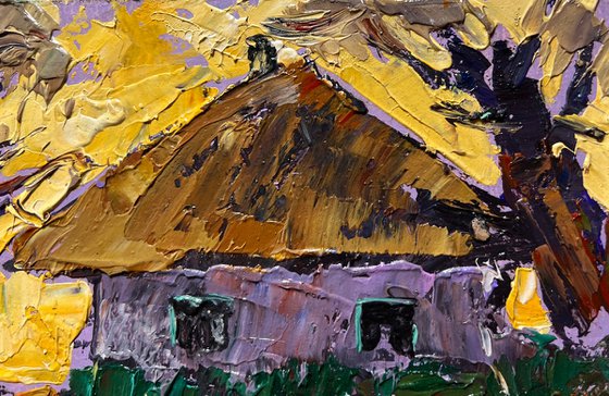 Yellow sunset behind houses