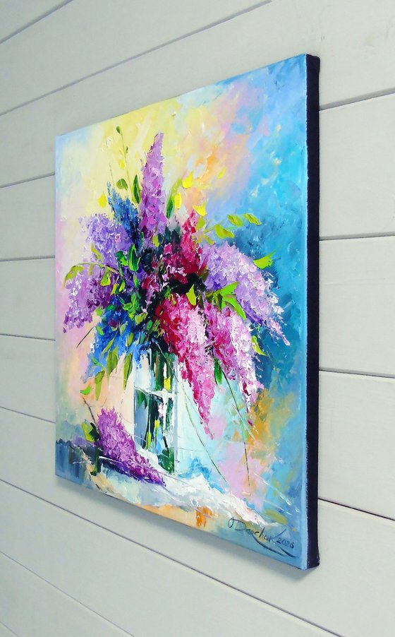 A bouquet of lilacs in a glass