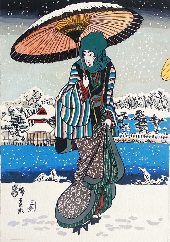 Young woman with umbrella and snow