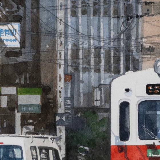 Red and White Tram in the City