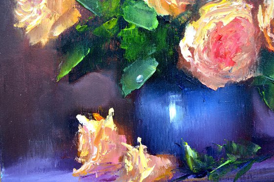 Yellow roses in a blue vase