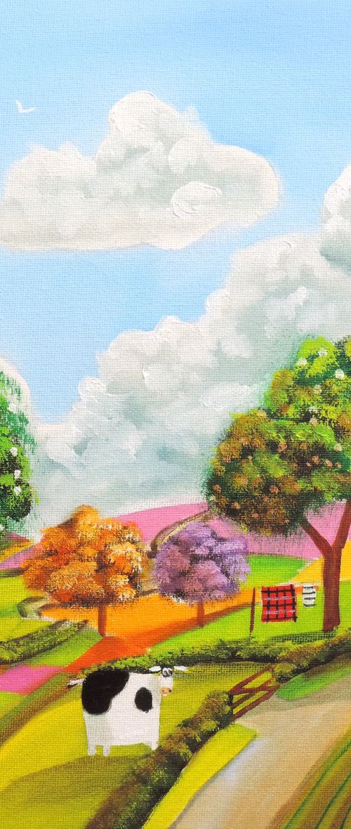 Folk art cow in a field by Gordon Bruce