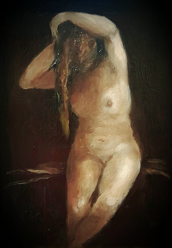 Woman drying her hair after a bath.