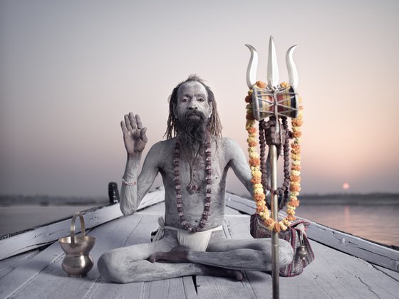 Portrait of Sadhu Naga Baba on the boat on the river Ganges