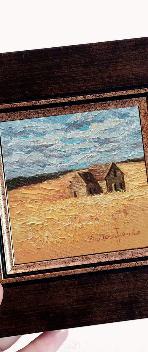 Barn in yellow field by Nataly Derevyanko