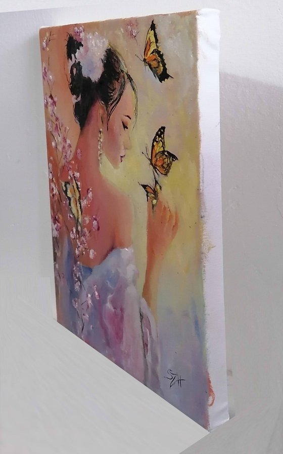 Portrait of a woman playing with Butterflies