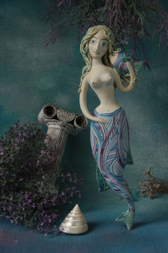 Mermaid with a fish,  Wall sculpture by Elya Yalonetski.