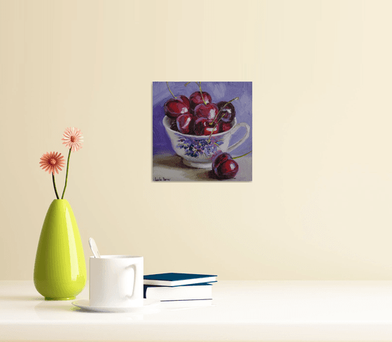 Cherries in porcelain cup