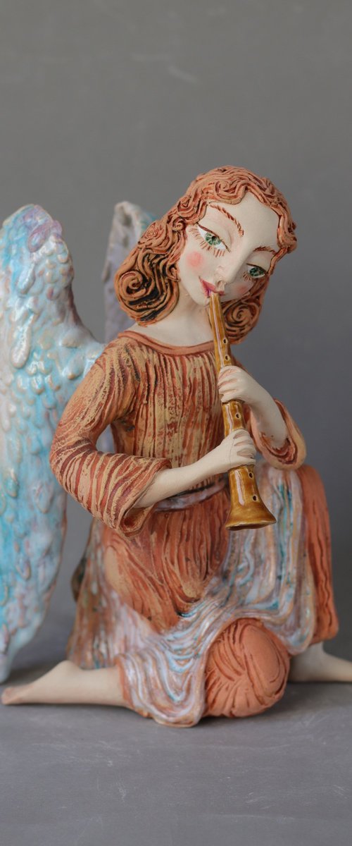 Sitting Angel with a flute. Ceramic OOAK sculpture. by Elya Yalonetski