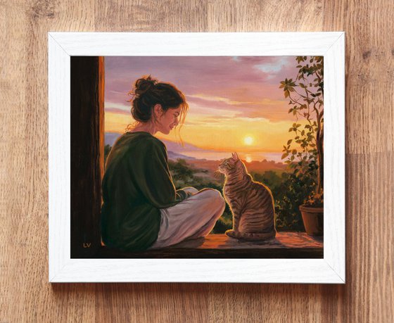 Girl watching the sunset with her tabby cat