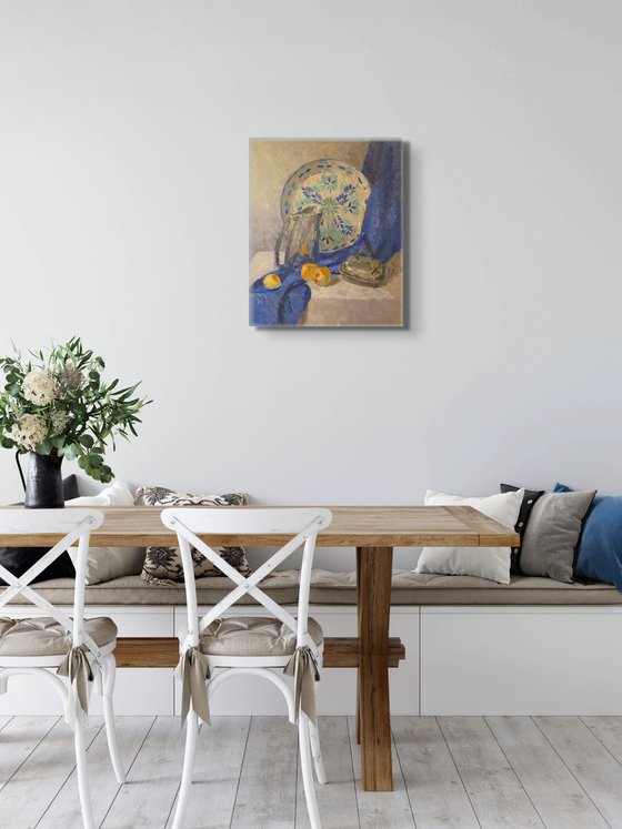 Silver jug and blue drapery