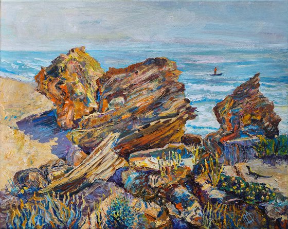 Coastal Rocks with Surfer