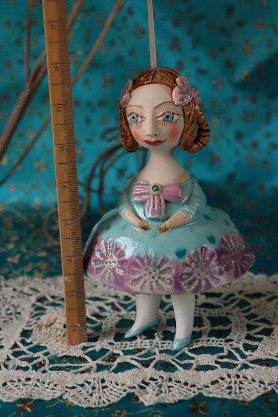 Little Girl in Mint Blue Dress. Tiny hanging sculpture