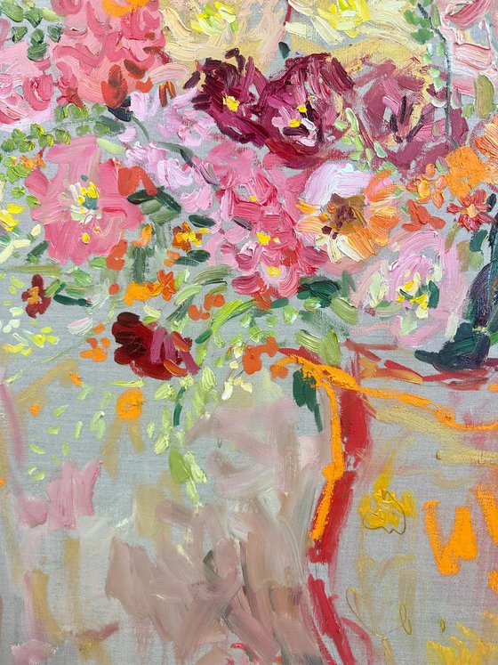 Bright flowers in a red jug