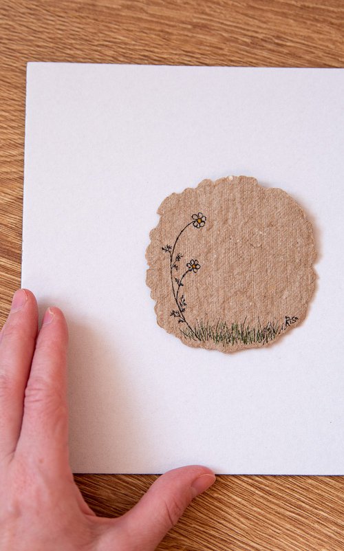One chamomile flower drawing on the author's craft paper by Rimma Savina