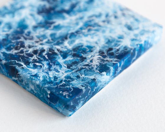 Miniature blue ocean waves
