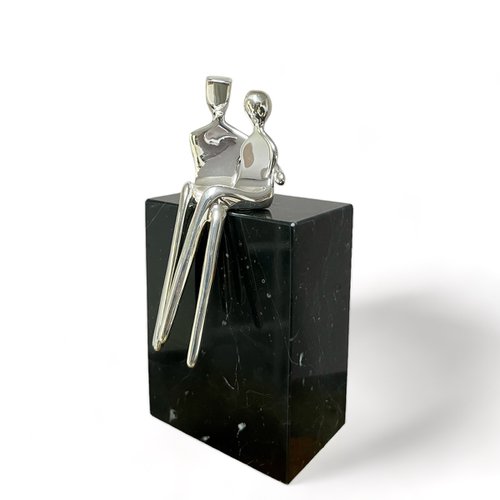 "Caress" a small  silver plated sculpture of a loving couple by Yenny Cocq