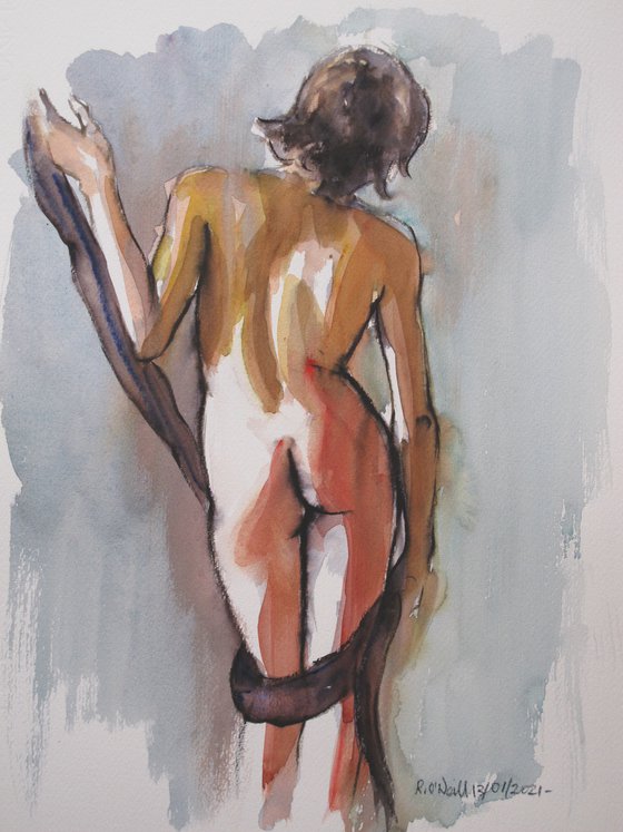 Standing female nude back view