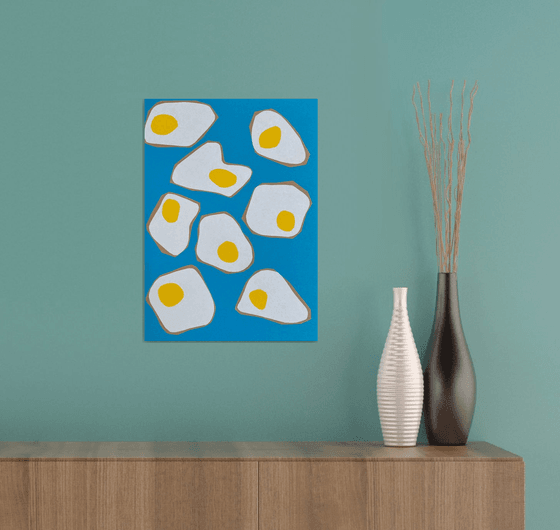 Fried Eggs on Blue Background