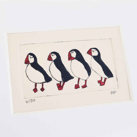 Small framed four puffins