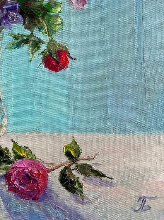 Still life with flowers. Turquoise background.