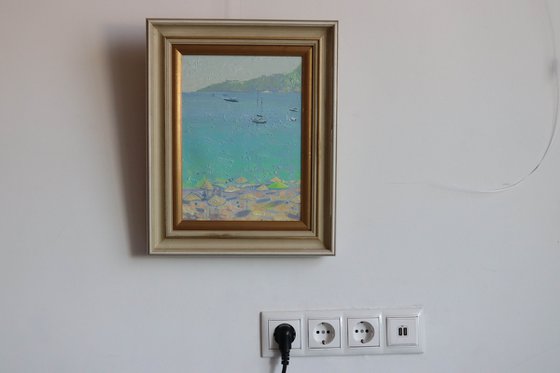 Yachts and umbrellas on the beach