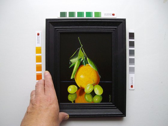 Orange with three grapes