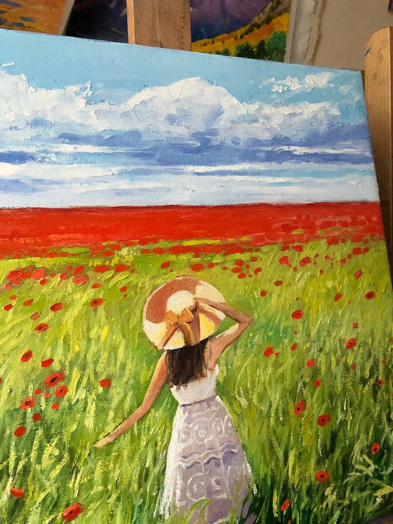 Women in poppy field