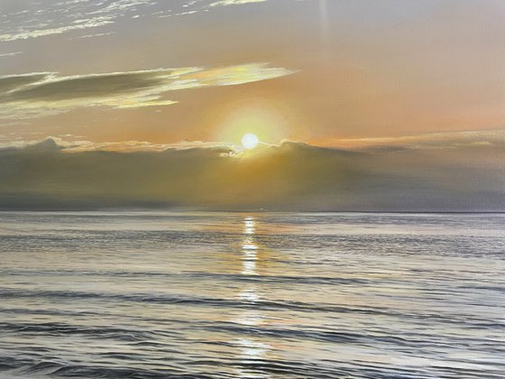 Golden Sunrise Over Calm Ocean