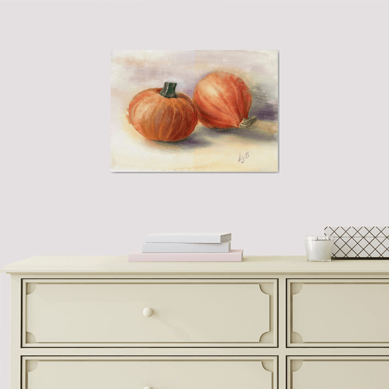 Still life with two pumpkins on a light background
