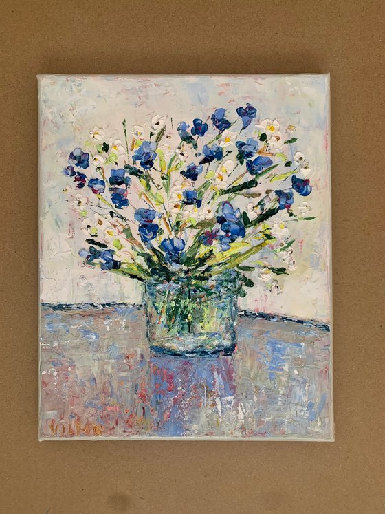 Bouquet of daisies and cornflowers