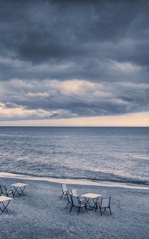 There are many empty seats in the coastal cafe before the storm. by Valerix