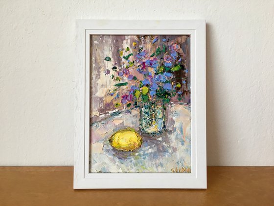 Still life with flowers and lemon