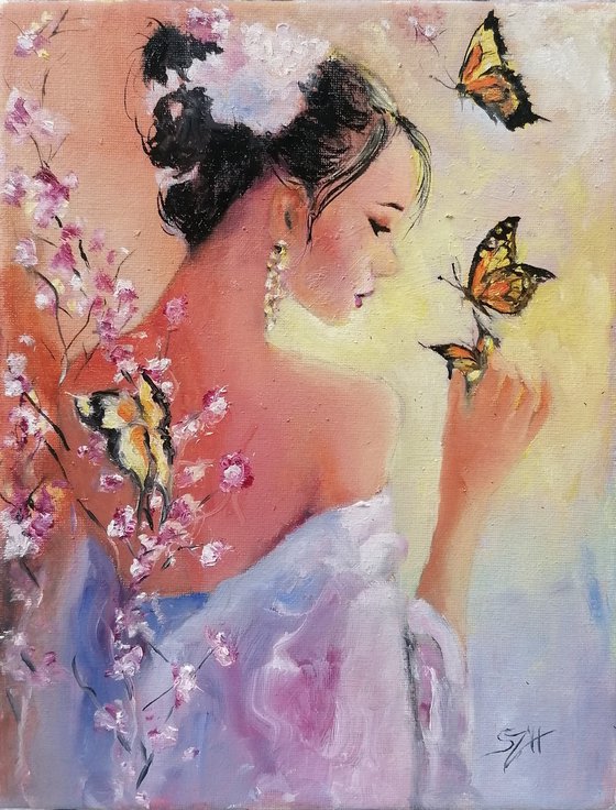 Portrait of a woman playing with Butterflies