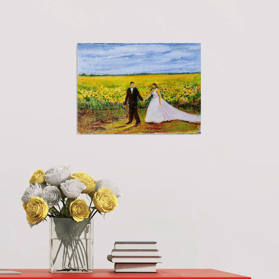 Newlyweds in a romantic Sunflower field