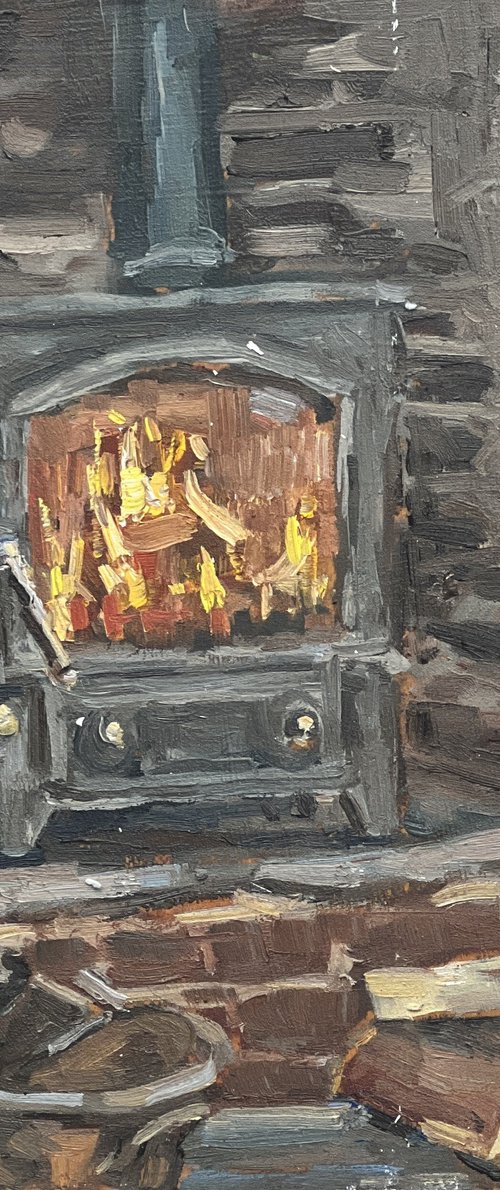 Wood burner ablaze by Louise Gillard