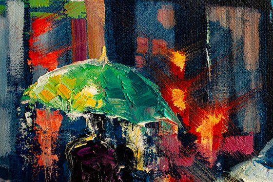 Night city lights, people with umbrellas