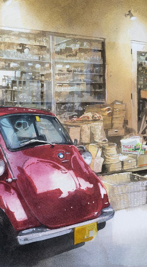 Red Vintage Car in Front of a General Store by Masato Watanabe
