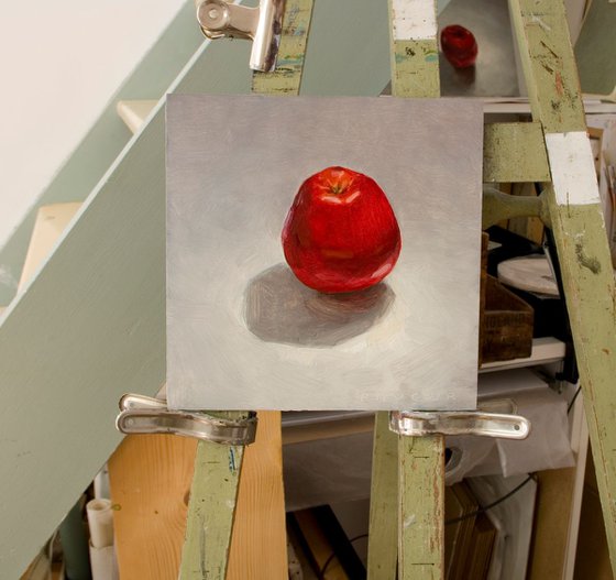 still life of red apple on a white background