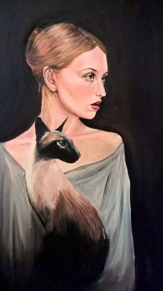 Woman with a siamese cat