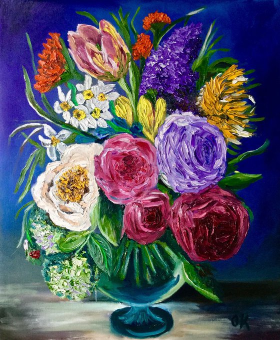 Bouquet of flowers.  Roses, tulips, daffodils, lilac, hydrangeas in a vase.