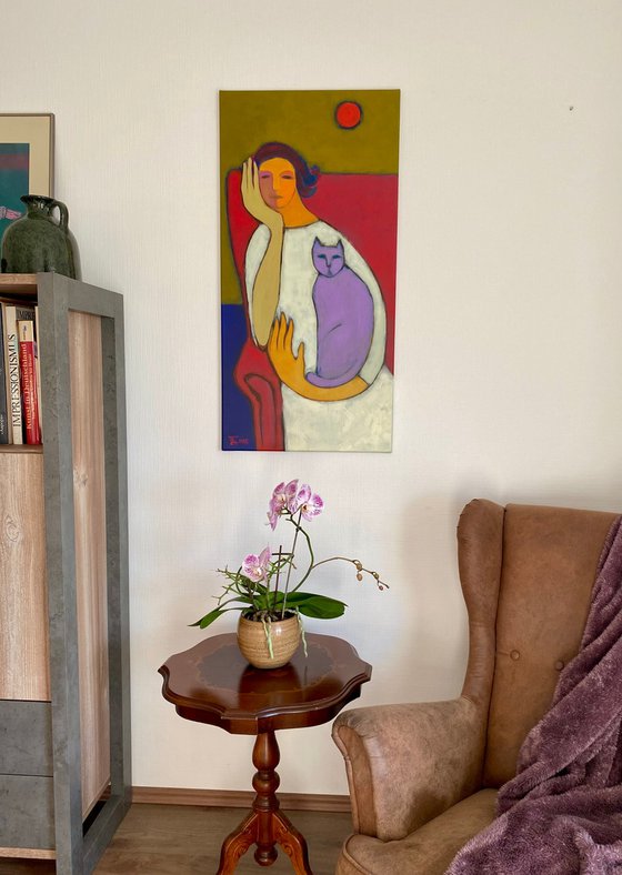 Portrait in a red chair.