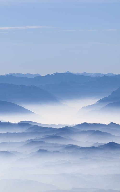 mountains covered with fog by Nikola Lav Ralevic