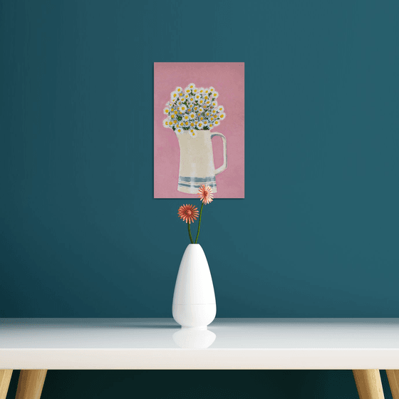 Daisies in vase on pink